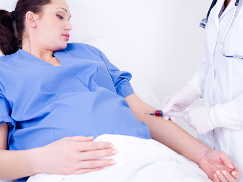 Pregnant woman having injection