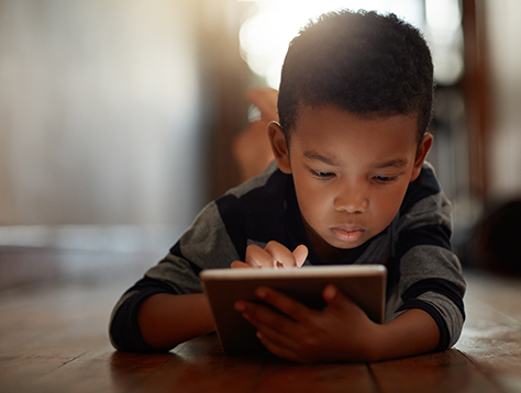 Young child on tablet 474