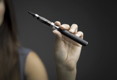 woman holding e-cigarette