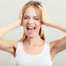 Woman holding her ears