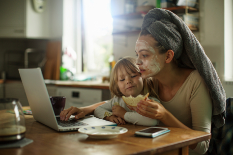 Mum with daughter having breakfast