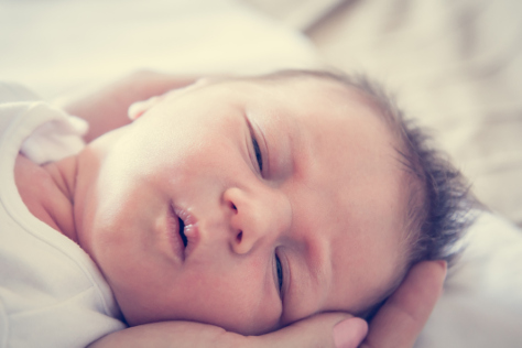 Newborn in mums arms