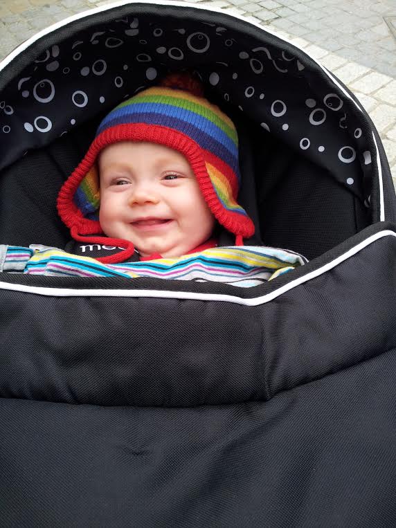 Image baby wrapped up warm outside in winter