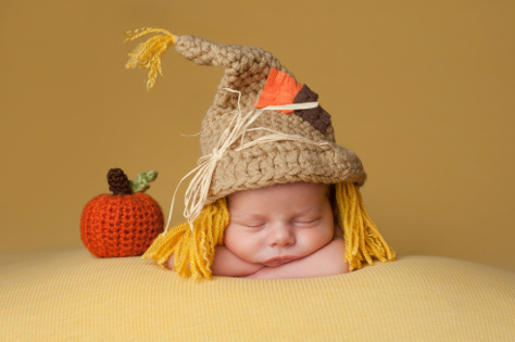 Newborn baby in Halloween costume