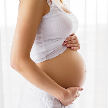 Pregnant woman holding bump