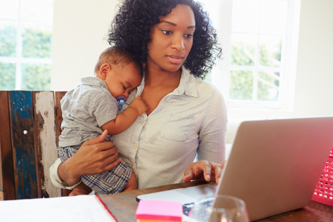 Mum working at home with baby