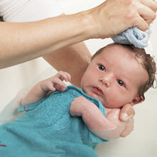 A baby being bathed
