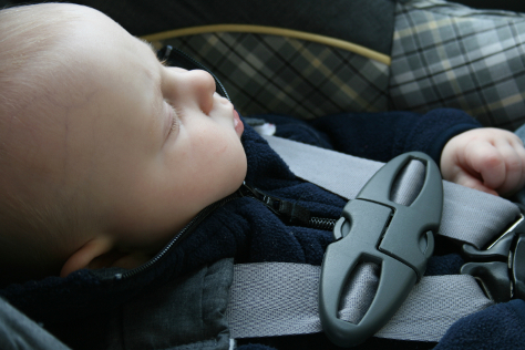 Baby strapped in car seat