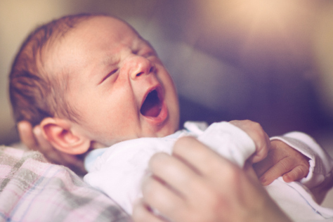 Newborn baby yawning