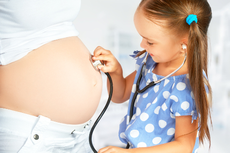 pregnant woman with daughter