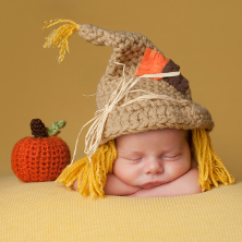 Newborn baby in Halloween costume