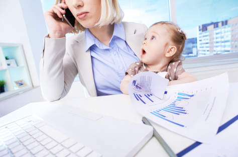 Mum on phone in office with baby