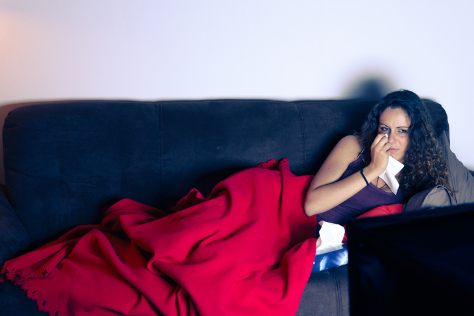 Woman crying watching TV