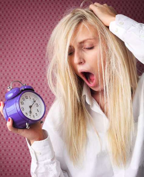 Mum holding clock yawning