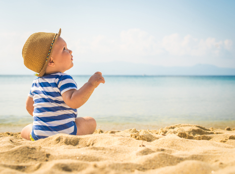 baby on the beach in the sun