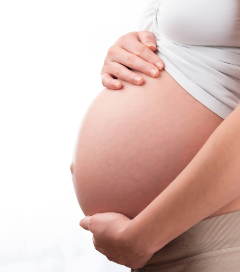 Pregnant woman with hands on her bump