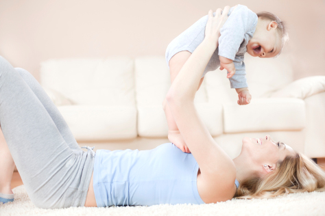 Mum holding baby in the air