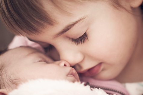 toddler with new baby