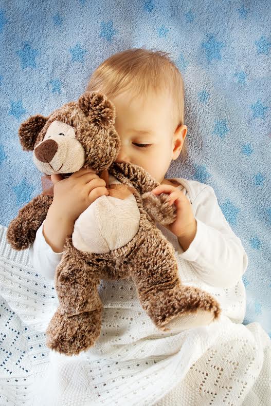 Image baby with toy stimulating sense of smell